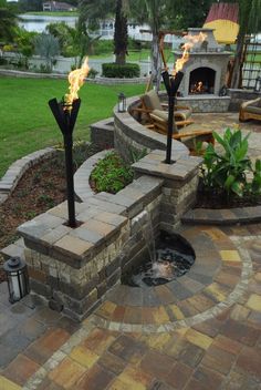 Beautiful back patio. Water-feature, fireplace &amp; nice touch with the???