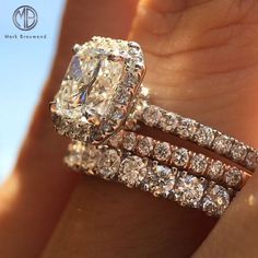 This 1.50ct radiant cut diamond engagement ring looks fantastic stacked with 2 wedding bands!
