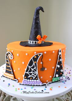 In this free cake decorating tutorial, learn to create the CUTEST Halloween themed cake with creatively decorated witch hats! - from <a href="http://mycakeschool.com" rel="nofollow" target="_blank">mycakeschool.com</a>
