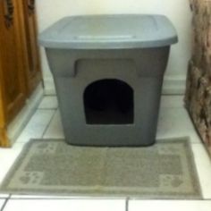 How to make your own DIY covered kitty litter box out of a plastic container. A super cheap and easy project and a great cat litter solution for people living in a small apartment. Photo from the article: Do It yourself Covered Kitty Litter Box: http://www.squidoo.com/do-it-yourself-covered-kitty-litter-box