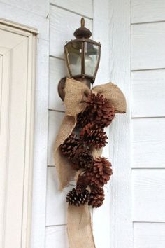 Burlap ribbon and pinecones wired together by camie1
