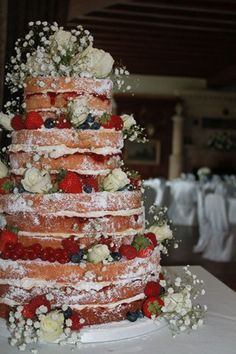 tiered victoria sponge with fresh fruit and flowers