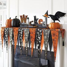 Get your house ready for Ghosts &amp; Goblins with this Easy No Sew Halloween Decorations like this no sew craft Halloween Mantel Cover.