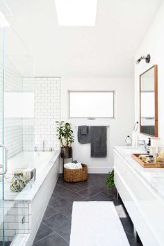 Love this large charcoal gray diagonal tiles on the floor paired with the white???