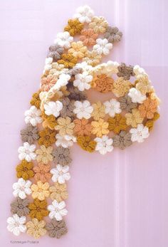 Crochet scarf pattern using the little "mollie flowers" pattern