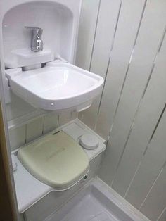 Toilet with fold up sink above for efficient use of space in in van interior converted by C?ide Campervan Conversions, Co. Donegal, Ireland...