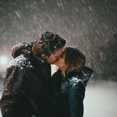 couple shares a kiss in the snow | relationship winter love