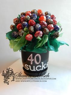 Tootsie Pop bouquet for a 40th birthday gift. Step by step tutorial on how to put it together