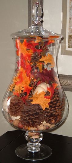 Have a jar and then decorate for each season or event - above for fall, decorations for christmas, sand and shells for summer etc.