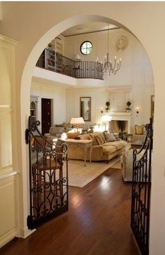 old gates can be used inside the home for dogs or babies. Great idea, and it looks better. and look at the open 2nd floor above the main family room. good ideas