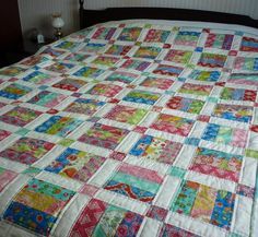 Jelly Roll Quilt - the white sashing and colored cornerstones make this a standout quilt.