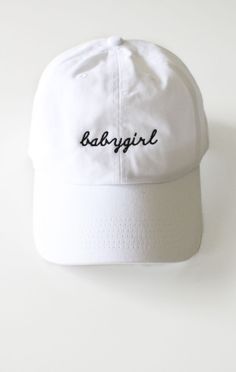 - Description Details: White six panel cap with &#39;babygirl&#39; embroidery &amp; adjustable back with tri-glide buckle. Brand: NYCT Clothing. 100% Chino Twill. Imported. All accessories are final sale. Sizing:
