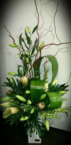 Whites, branches &amp; greens make a stunning arrangement suitable for funeral home or house.