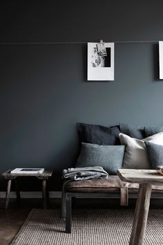 Charcoal is a soothing paint color for the living room, accent with textures of linen and sheepskin and adorn with black and white photography...