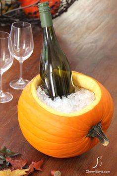Fill a scooped out pumpkin with ice for the perfect place to cool beverages at your next party. For the best results, look for a pumpkin that can lay flat on its side. Click through for the tutorial and more interesting ways to use a pumpkin at this year&#39;s Halloween party.