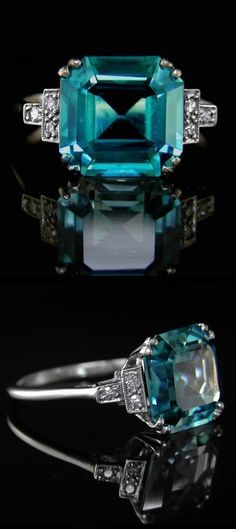 Rare Blue Zircon Ring A 1930&#39;s Art Deco original. The fine Blue Zircon measuring approximately 10.4mm x 10.1mm and estimated to weigh 6.00cts. Mounted with three old brilliant cut diamonds set to each shoulder. A lovely original Art Deco ring.