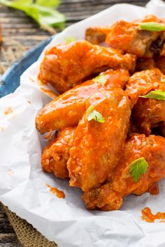 Oven baked buffalo chicken wings take al little time to make, but once you smother them in sauce they are worth all the effort!