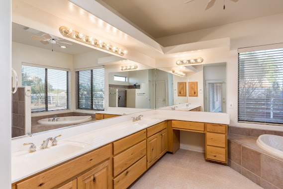 picture of master bathroom garden tub, walk-in shower, and double sinks