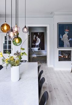 Beautiful pendants over the dining table in different colors.