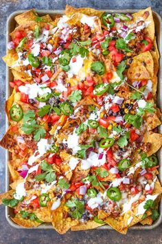 Loaded nachos that are guaranteed to be a crowd-pleaser! Simply layer your toppings, bake onto a sheet pan and serve. Done.