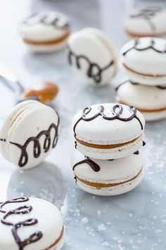 Salted Caramel Macarons dressed up in a white shell, dark chocolate, Fleur de Sel and homemade salted caramel.