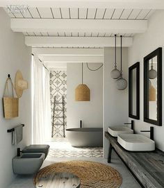 Love the use of natural fibres and simple black accessories in this bathroom.