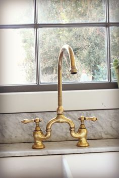 Lovely unlacquered brass faucet.