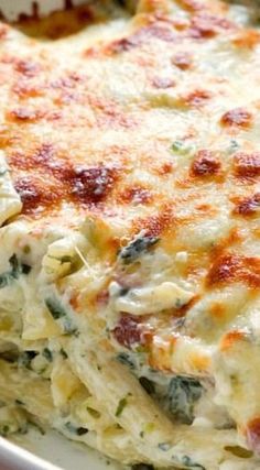 Cheesy Spinach Dip Chicken Pasta ??? your new favorite dinner! Spinach dip and pasta get together to create one cheesy and creamy dish! You need to make it!
