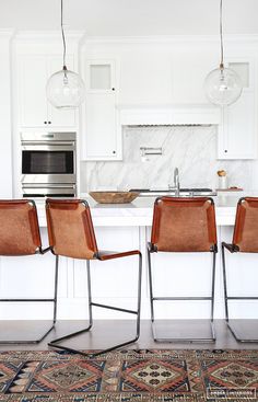 clean white + leather chairs