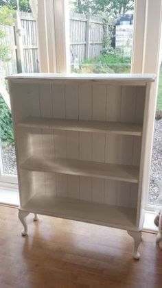 Simply replace backs of a bookcase with beadboard, add legs and paint! What a???