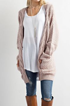 This Cable Knit Cardigan Sweater is so on trend this season! This cozy slightly oversized sweater is soft and features an open front with two front pockets. Throw this on over your favoruite shirt and