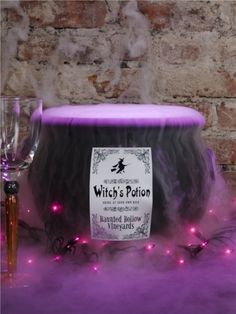 Halloween cauldron with purple fog potion &amp; lights
