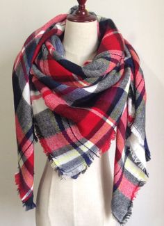 This extra soft scarf is perfect to keep you warm and stylish the whole water and fall season. Tis scarf is plaid with red, black, and white. Size: 55 inches by 55 inches