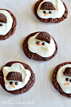 Melting Snowmen (Chocolate Mint) Cookies | Kitchen Meets Girl | A basic cake mix cookie recipe, some mint flavoring, and Candiquik to melt the snowmen. Pop on a (half) Reese???s Peanut Butter cup for a hat, mini chocolate chips for eyes, and use an orange jimmy for the nose! Try them here.