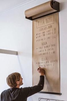 very cool; hang a large roll of paper on the wall and use as menu board... or anything else