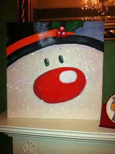 cute idea ??? paint a snowman on a board or canvas as Christmas decoration ??? and, don&#39;t forget the sparkles ??????