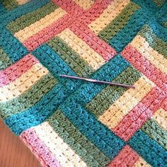 Sonoma Crochet Baby Blanket- This striped granny square baby blanket looks so unique!