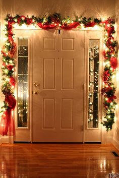 Inside front door at Christmas ...I like the tule intertwined - Click image to find more Holidays &amp; Events Pinterest pins