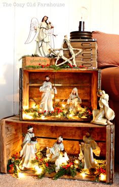 Such a pretty way to display a nativity... Or a Christmas village! wood crates. I like the idea of stacking these to make a pseudo bookshelf for a rustic Christmas display, and I love the lights inside, everything looks better lit up!