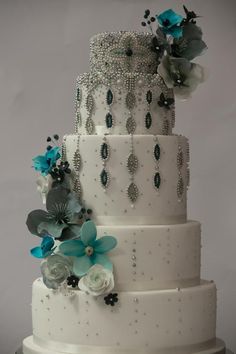 This was the first Asian wedding cake at Happyhills Cakes, was really fab to be able to go to town with glamorous beads and beautiful colours, all in keeping with the bride???s fully beaded dress and turquoise wrap. It was fascinating to see the...