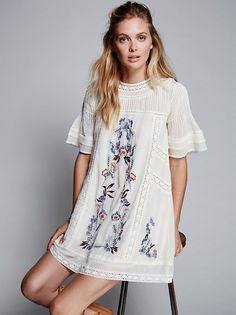Effortless and shapeless Victorian-inspired mini dress featuring a beautiful???