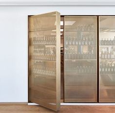 Stunning door-like beverage storage designed by Retail Architects and ??rstiderne???