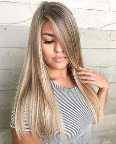 Long blonde hair with side-swept bangs by Karen Soriano