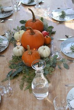 Fall centerpiece. So simple and so beautiful. Maybe too expensive with that many pumpkins per table? I don&#39;t know. Certainly less work than doing arrangements in 40 some pumpkins per table.
