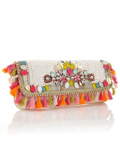 Suzie Tassel Beaded Clutch ?47.00 Unique and exotic heavily embellished clutch with bright summery beading, shell and diamante detail and tassel all around trim. Statement wow clutch perfect for summer.