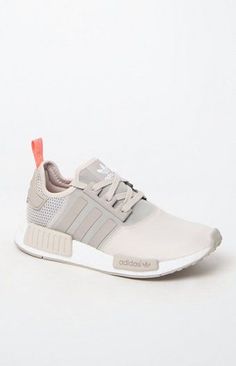 adidas combines modern streetwear style with innovative technology in the Women&#39;s NMD_R1 Brown Low-Top Sneakers. Fashioned in a brown hue, these low-top sneakers feature a soft suede and peached jersey upper, durable and shock-resistant angled boost??? midsole with built-in EVA plugs, and bold archival details. boost???&#39;s energy-returning properties keep every step charged with an endless supply of light, fast energy Premium suede and peached jersey upper Overlock deco stitching...