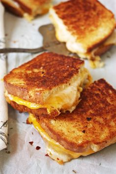 Fancy Schmancy Grilled Cheese - This is seriously the best grilled cheese sandwich you will ever have! Brushed with a garlic, red pepper flake, and thyme infused butter and stuffed with three different cheeses, this crispy and melty sandwich will be a household favorite! <a href="http://TheGarlicDiaries.com" rel="nofollow" target="_blank">TheGarlicDiaries.com</a>
